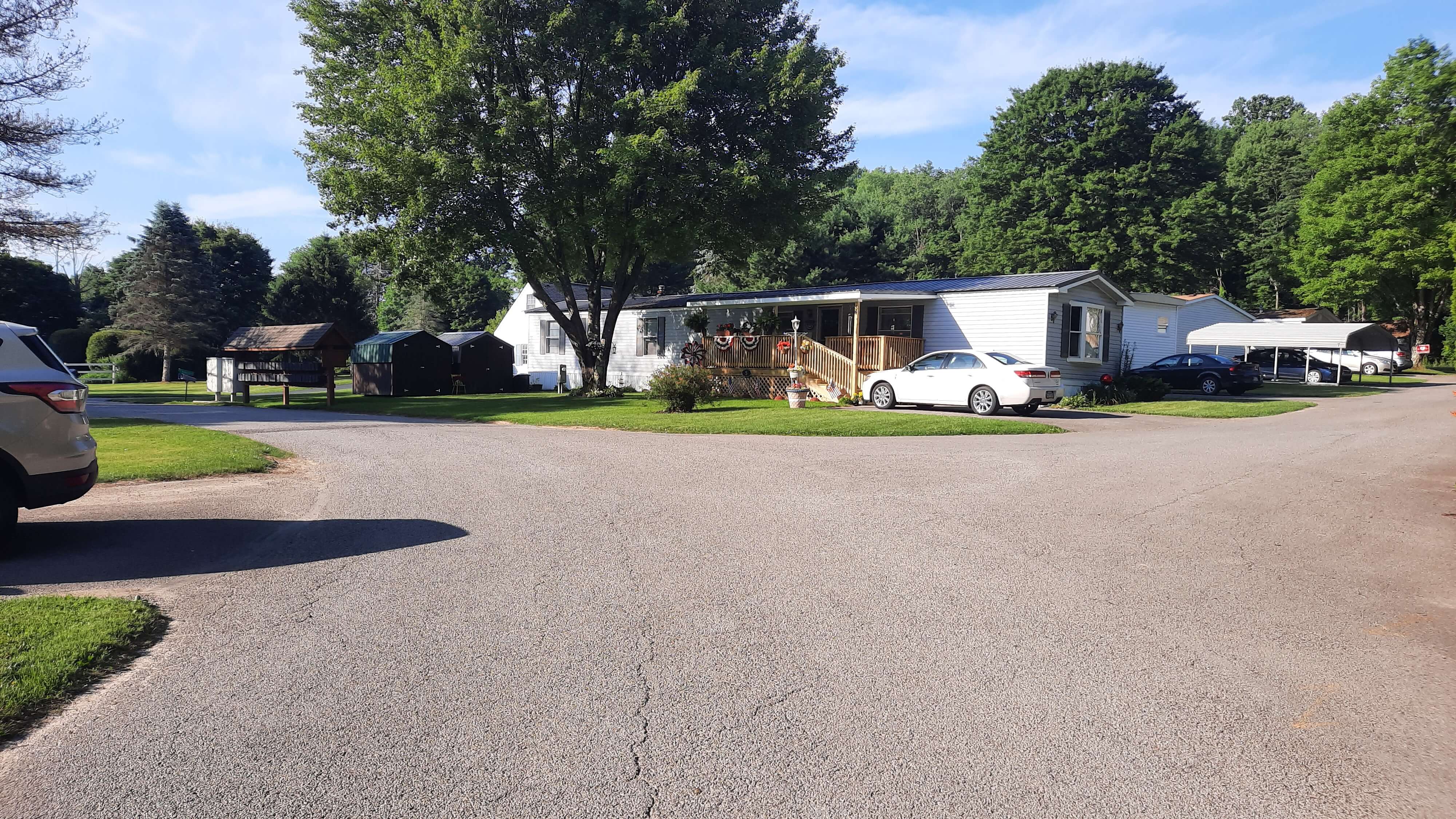 Sunny road and house on intersection