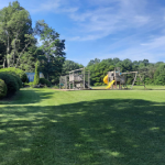 Playground with slide and swings icon