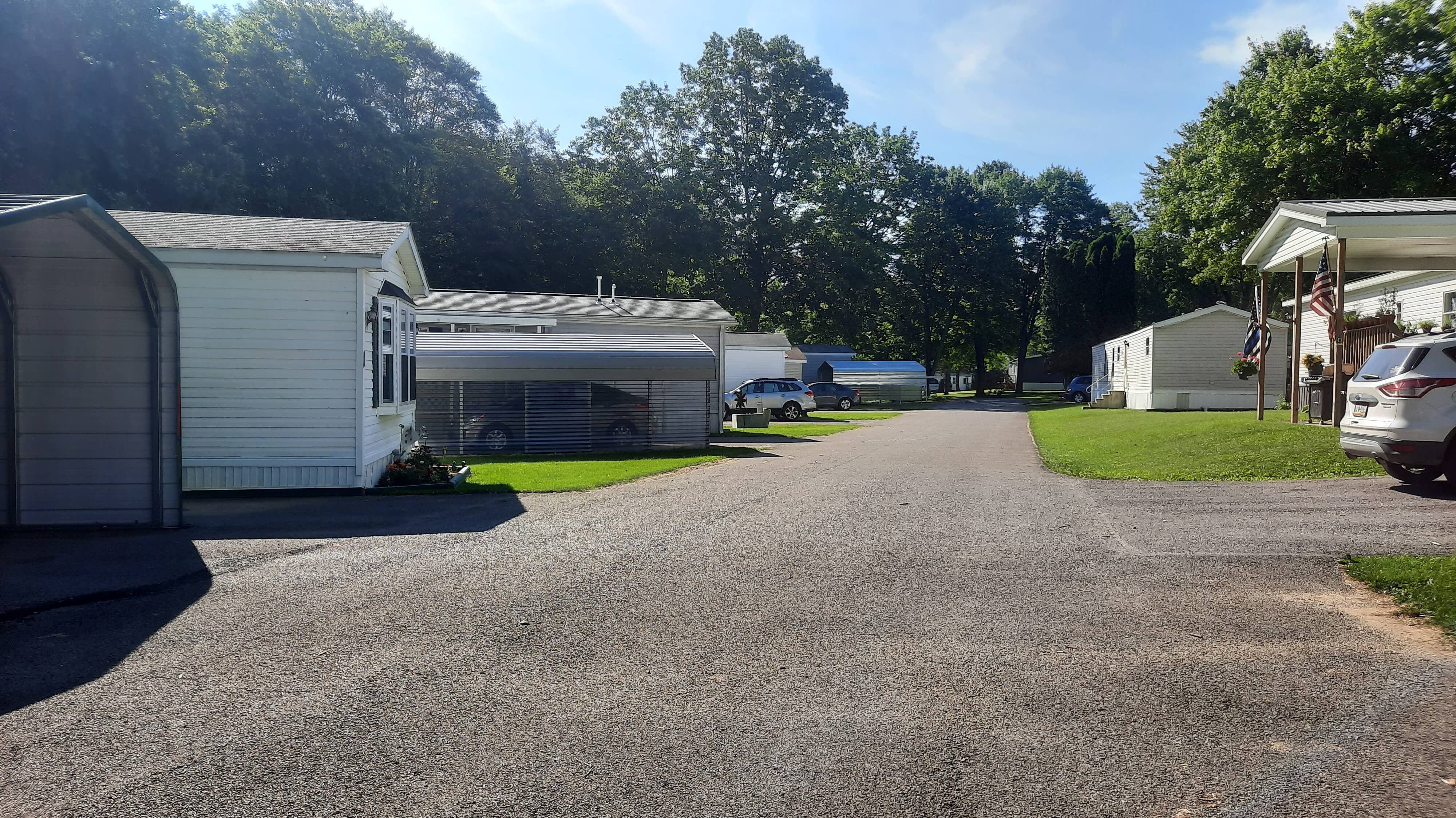 Alernate view of community road with covered parking spaces